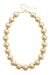 The Polka Dot Press Marjorie beaded necklace featuring chunky, shiny gold resin beads with an adjustable 16-inch chain.